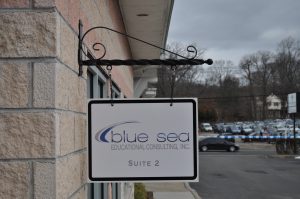 Corpus Christi Wayfinding Signs outdoor hanging blade sign blue sea building business wayfinding address sign 300x199